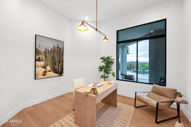 office area with light wood-style flooring, baseboards, and recessed lighting