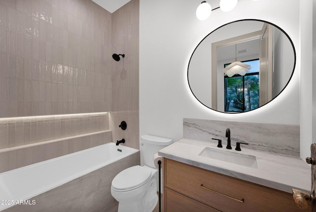 bathroom with shower / bath combination, vanity, and toilet
