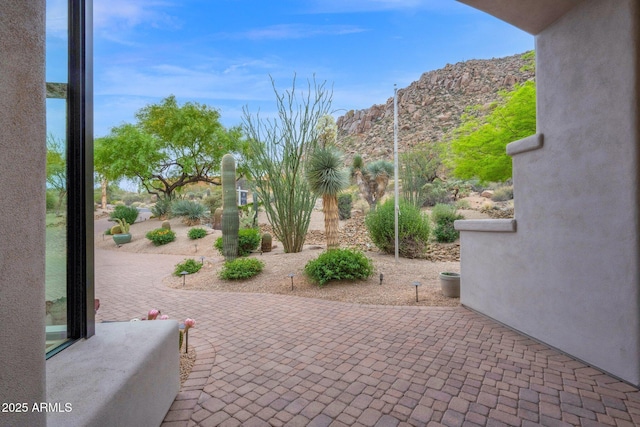 view of patio / terrace featuring a mountain view