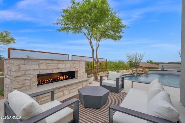 view of patio / terrace featuring an outdoor pool and an outdoor living space with a fireplace