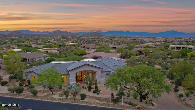 birds eye view of property with a mountain view and a residential view