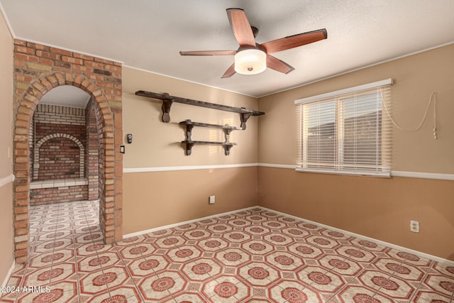 spare room with ceiling fan