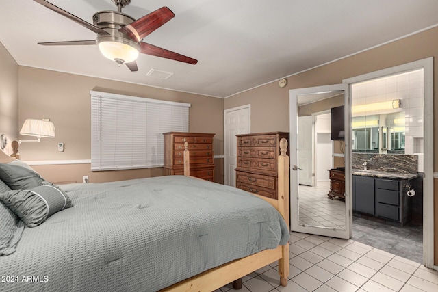 tiled bedroom with ceiling fan