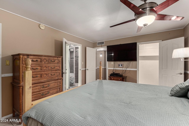 bedroom featuring ensuite bathroom and ceiling fan