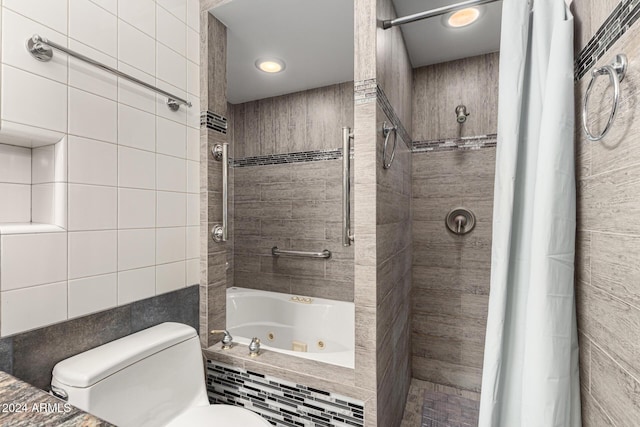 bathroom featuring tile walls and toilet