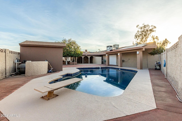 view of pool featuring central AC unit and a patio