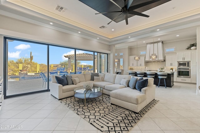 living area featuring light tile patterned floors, recessed lighting, and visible vents