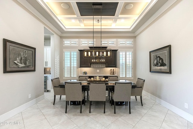 dining area with light tile patterned floors, coffered ceiling, a high ceiling, and baseboards