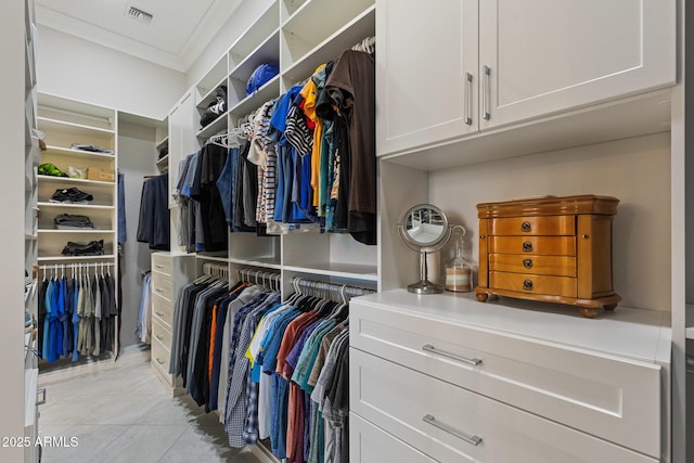 walk in closet featuring light tile patterned flooring and visible vents