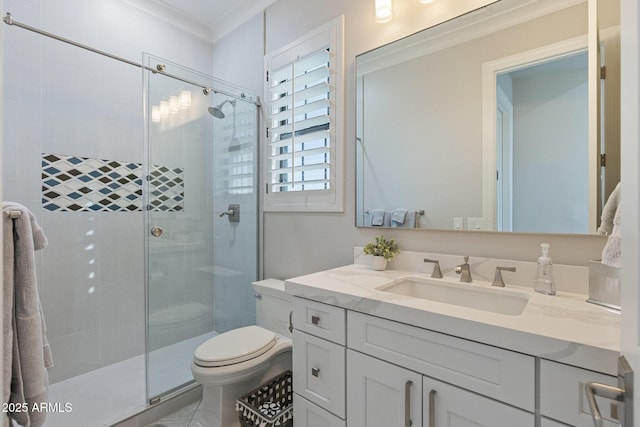 bathroom with a stall shower, toilet, vanity, and ornamental molding