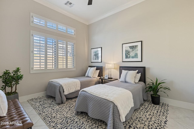 bedroom featuring light tile patterned flooring, visible vents, crown molding, and baseboards