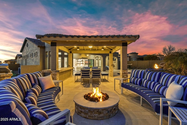 view of patio / terrace with a gazebo and an outdoor living space with a fire pit