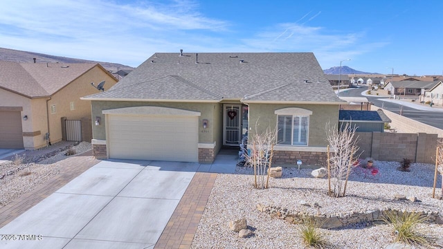 ranch-style house with a mountain view and a garage