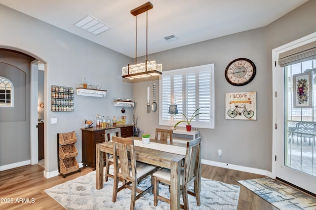 dining space with light wood-type flooring