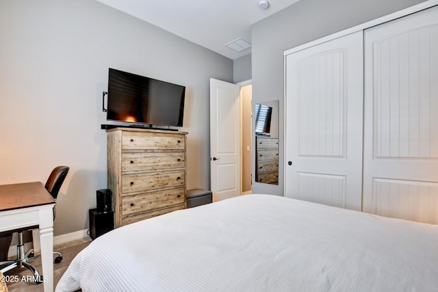 bedroom with a closet and carpet flooring