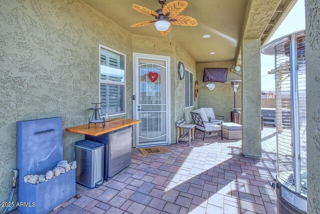 view of patio / terrace with ceiling fan