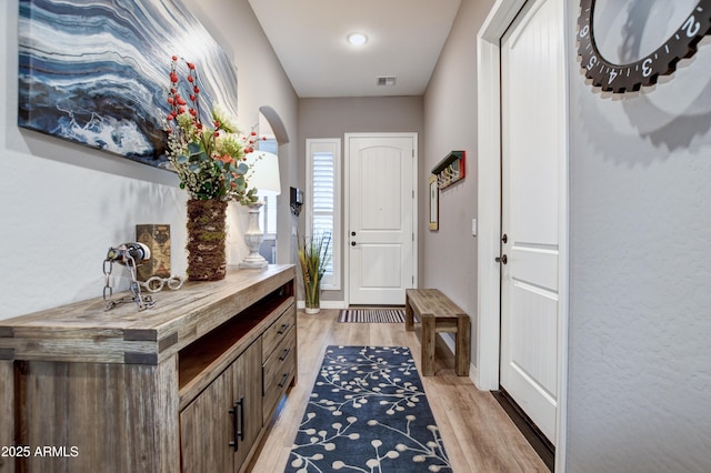 doorway to outside featuring light hardwood / wood-style flooring