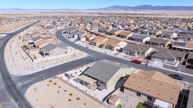 birds eye view of property featuring a mountain view