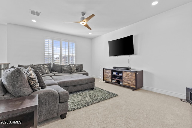 carpeted living area with recessed lighting, visible vents, baseboards, and a ceiling fan