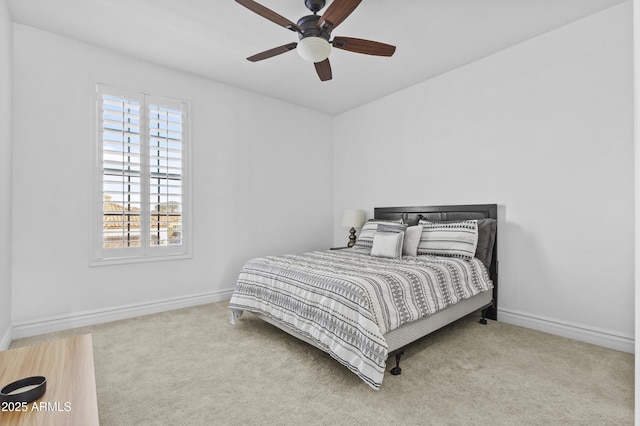 bedroom featuring baseboards, carpet floors, and ceiling fan