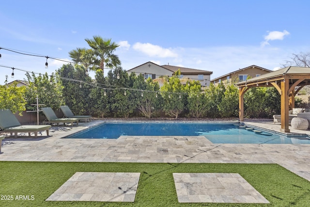 view of swimming pool with a fenced backyard, a gazebo, a yard, a fenced in pool, and a patio area