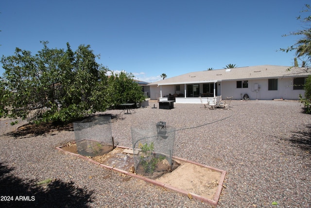 rear view of house featuring a patio area