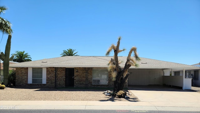 single story home with a carport