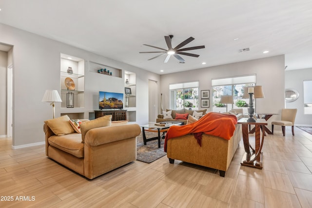 19045 N 269th Dr, Buckeye, AZ 85396 - living room with a ceiling fan, built in features, recessed lighting, baseboards, and light wood-type flooring