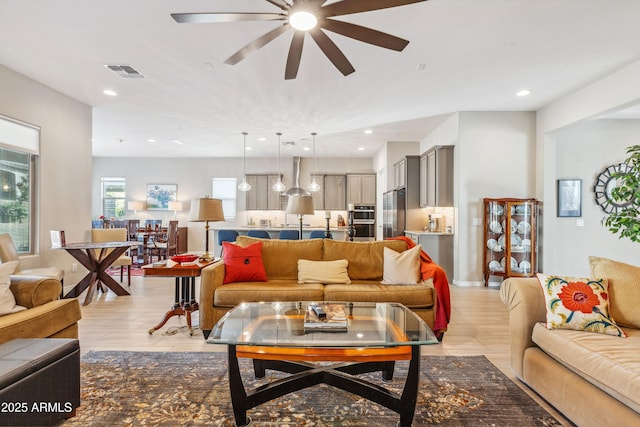 19045 N 269th Dr, Buckeye, AZ 85396 - living room with ceiling fan, recessed lighting, and light wood-type flooring