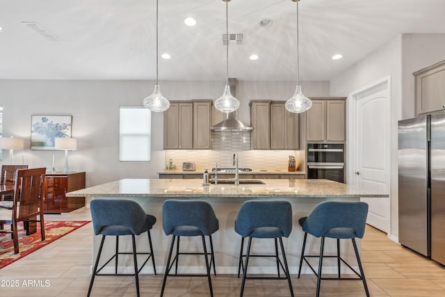 19045 N 269th Dr, Buckeye, AZ 85396 - kitchen with freestanding refrigerator, double wall oven, backsplash, a breakfast bar area, and recessed lighting