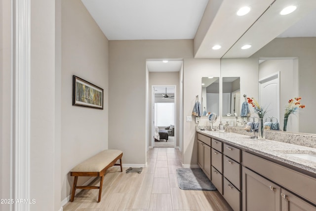 19045 N 269th Dr, Buckeye, AZ 85396 - ensuite bathroom with recessed lighting, double vanity, baseboards, and a ceiling fan