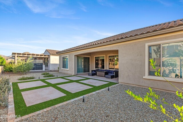 19045 N 269th Dr, Buckeye, AZ 85396 - back of property with an outdoor living space, stucco siding, a patio, and a tile roof