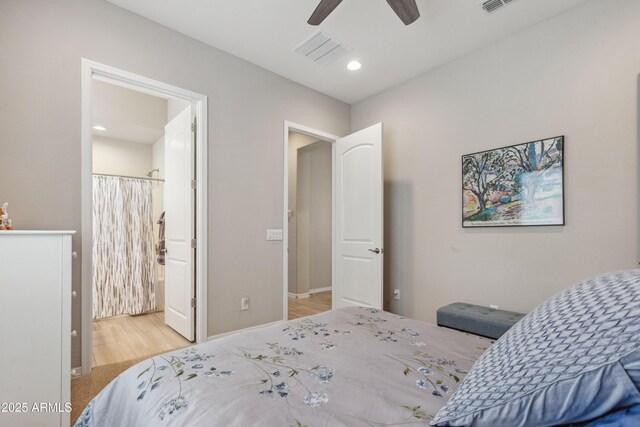 19045 N 269th Dr, Buckeye, AZ 85396 - bedroom with wood finished floors, a ceiling fan, ensuite bath, baseboards, and recessed lighting
