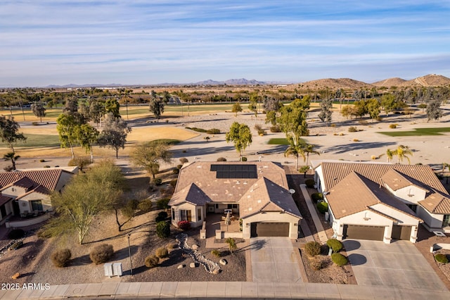 birds eye view of property featuring a mountain view