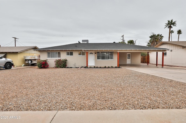 ranch-style house featuring a carport