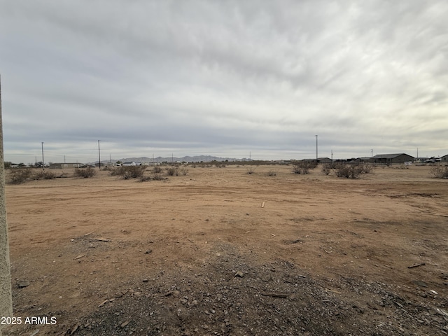 view of yard with a rural view