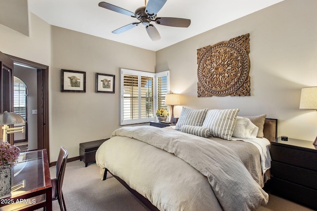 carpeted bedroom featuring ceiling fan