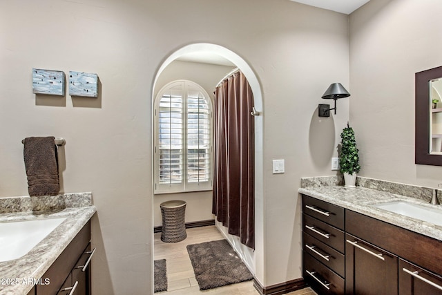 bathroom featuring hardwood / wood-style flooring and vanity