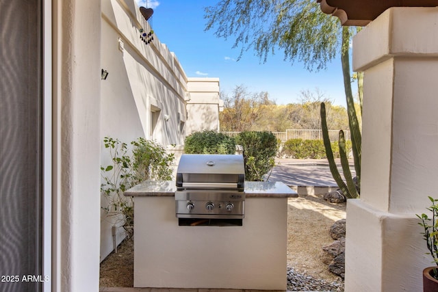 view of patio featuring exterior kitchen and area for grilling