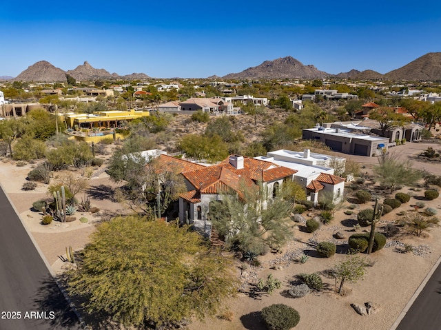 birds eye view of property featuring a mountain view