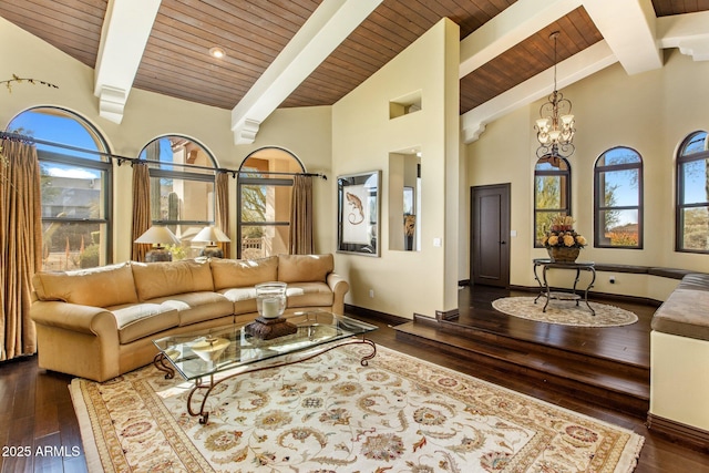 living room with dark wood-type flooring, an inviting chandelier, beam ceiling, and high vaulted ceiling