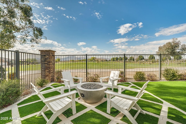 view of patio / terrace featuring an outdoor fire pit