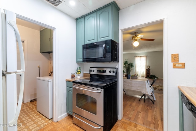 153 E Buena Vista Ave, Goodyear, AZ 85338 - kitchen with appliances with stainless steel finishes, washer / clothes dryer, blue cabinets, ceiling fan, and light countertops