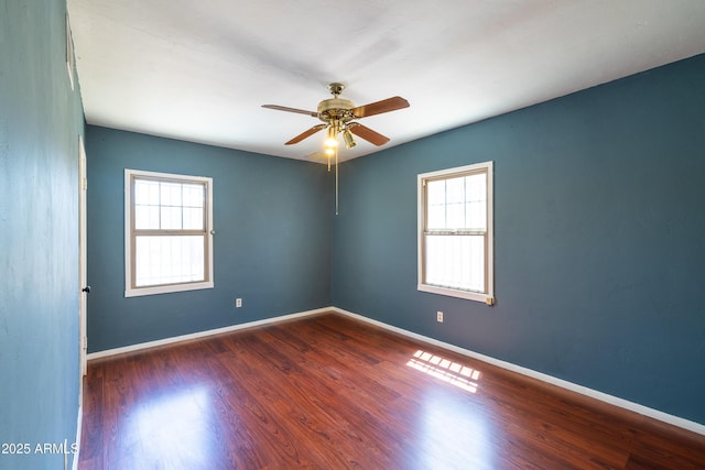 153 E Buena Vista Ave, Goodyear, AZ 85338 - unfurnished room with plenty of natural light, a ceiling fan, and wood finished floors