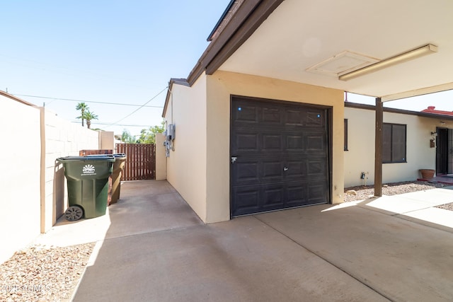 153 E Buena Vista Ave, Goodyear, AZ 85338 - view of side of property featuring stucco siding, a gate, and concrete driveway