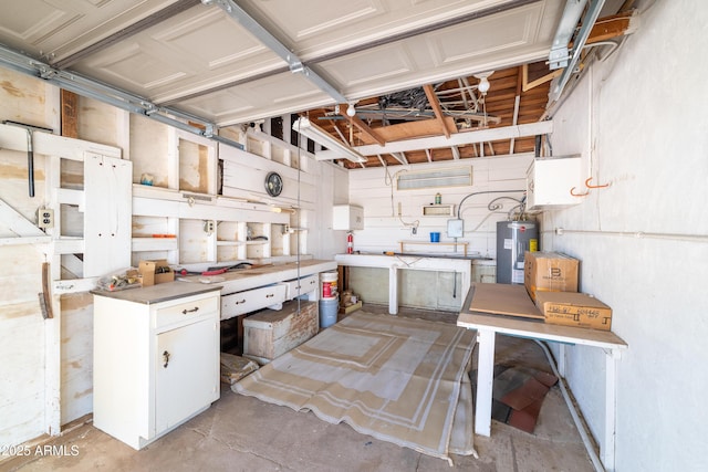 153 E Buena Vista Ave, Goodyear, AZ 85338 - kitchen with electric water heater, unfinished concrete floors, and white cabinetry
