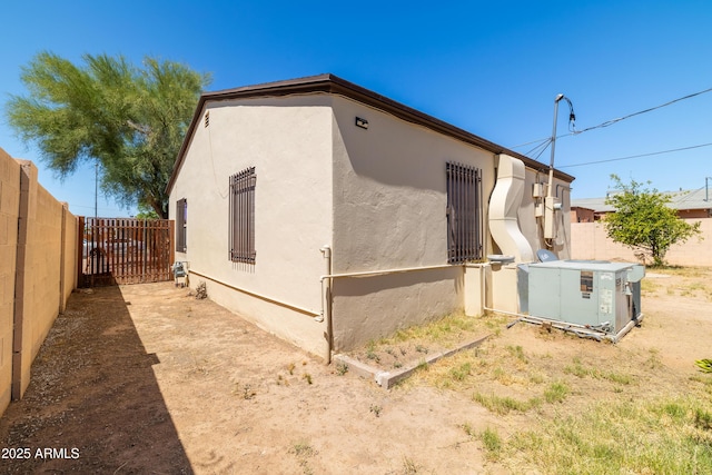 153 E Buena Vista Ave, Goodyear, AZ 85338 - view of property exterior featuring stucco siding and a fenced backyard