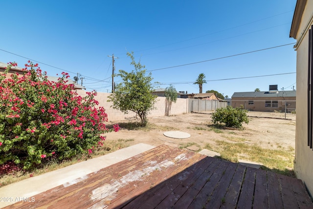 153 E Buena Vista Ave, Goodyear, AZ 85338 - fenced backyard with a wooden deck