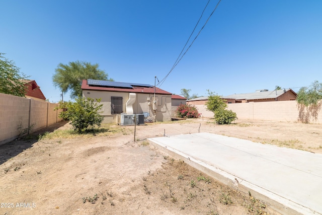 153 E Buena Vista Ave, Goodyear, AZ 85338 - back of house featuring roof mounted solar panels and stucco siding