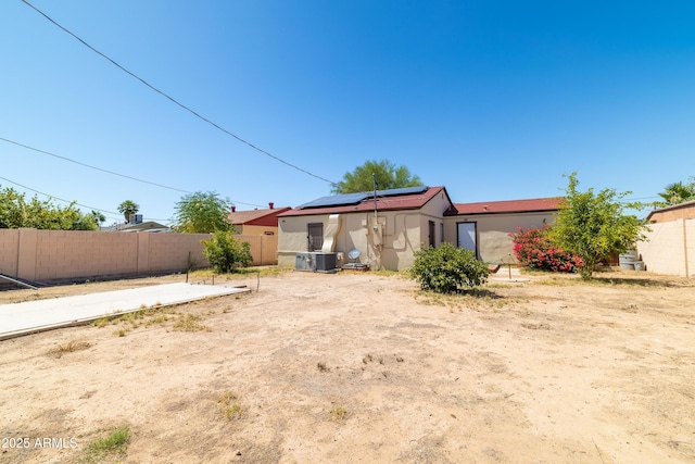 153 E Buena Vista Ave, Goodyear, AZ 85338 - back of property featuring roof mounted solar panels and stucco siding